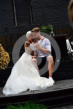 Happy young wedding couple kissing and hugging