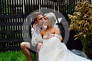 Happy young wedding couple kissing and hugging