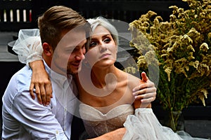 Happy young wedding couple kissing and hugging