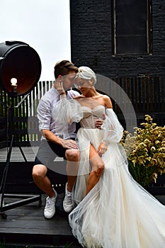 Happy young wedding couple kissing and hugging