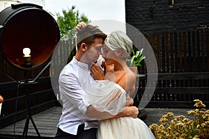 Happy young wedding couple kissing and hugging