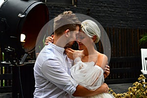 Happy young wedding couple kissing and hugging