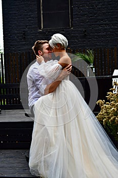 Happy young wedding couple kissing and hugging