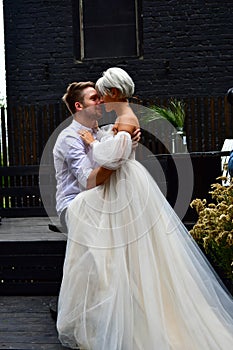 Happy young wedding couple kissing and hugging