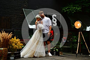 Happy young wedding couple kissing and hugging