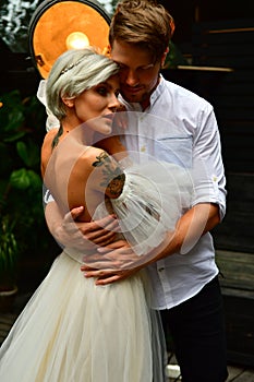 Happy young wedding couple kissing and hugging