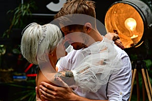 Happy young wedding couple kissing and hugging