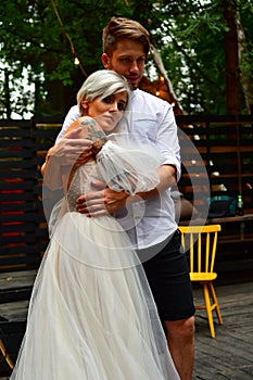 Happy young wedding couple kissing and hugging