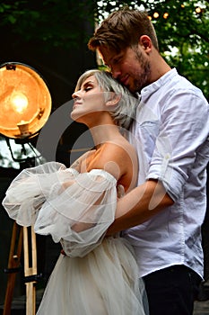 Happy young wedding couple kissing and hugging