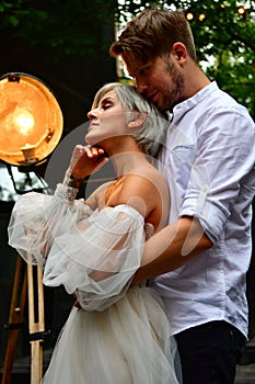 Happy young wedding couple kissing and hugging