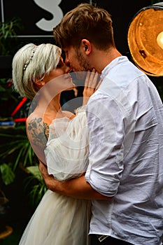 Happy young wedding couple kissing and hugging