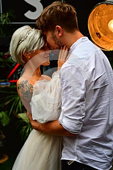 Happy young wedding couple kissing and hugging