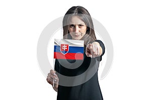 Happy young white woman holding flag of Slovakia and points forward in front of him isolated on a white background