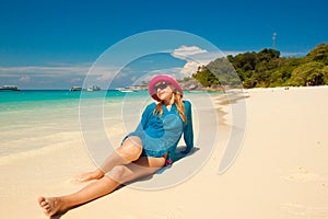 Happy young woman against sea