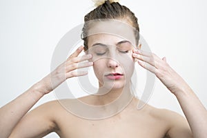 Happy Young Woman After Applying Cream on Her Face Studio Shot on White Background