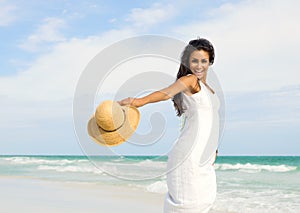 Happy young woman at the beach