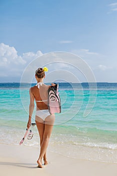 Happy young woman on the beach