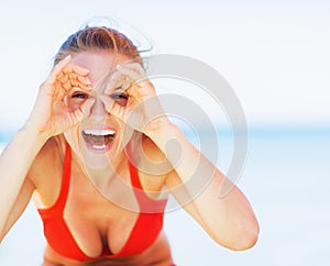 Happy young woman on beach having fun