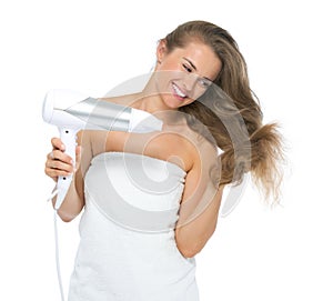 Happy young woman blow-dry