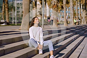 Happy young woman breathing deep fresh air