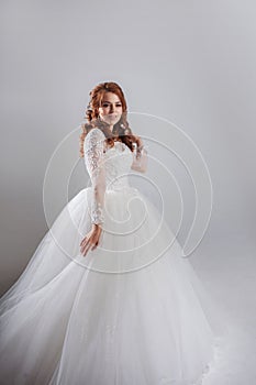 Happy young woman bride in a lavish wedding dress.