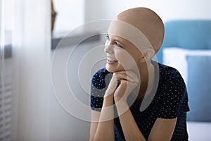 Happy young woman with cancer feel optimistic thinking