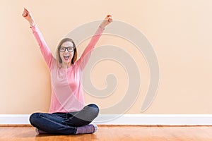 Happy young woman cheering