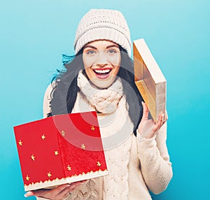 Happy young woman with Christmas present box