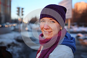 Happy young woman in city