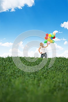 Happy young woman with colorful balloons