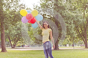 Happy Young Woman With Colorful Balloons