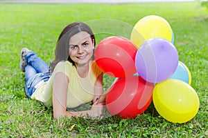 Happy Young Woman With Colorful Balloons