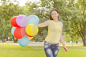 Happy Young Woman With Colorful Balloons