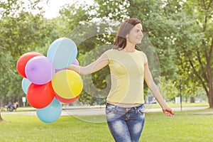 Happy Young Woman With Colorful Balloons