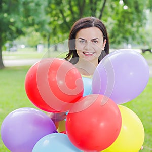 Happy Young Woman With Colorful Balloons