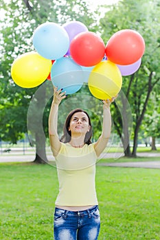 Happy Young Woman With Colorful Balloons