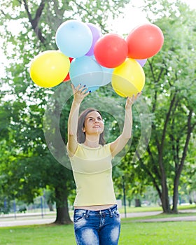 Happy Young Woman With Colorful Balloons