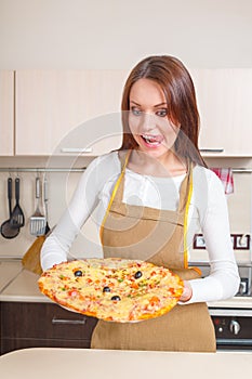 Happy Young Woman Cooking Pizza