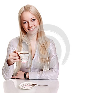 Happy young woman with cup of coffee