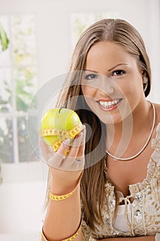 Happy young woman on diet