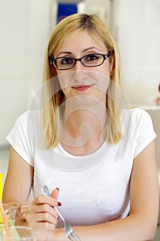 Happy Young Woman Dining Out