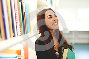 Happy young woman dreaming of her studies