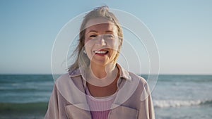 Happy Young Woman Enjoys Life,Portrait woman smiling at ocean landscape blue sky