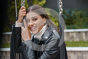 Happy young woman entering her second childhood