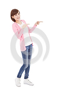 Happy young woman finger pointing something