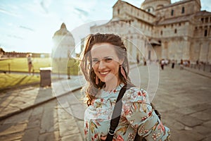 happy young woman in floral dress having excursion