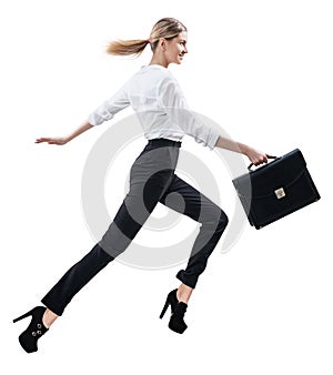 Happy young woman in formal wear jumping .