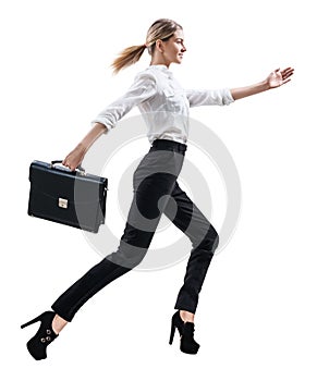 Happy young woman in formal wear jumping .