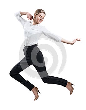 Happy young woman in formal wear jumping .