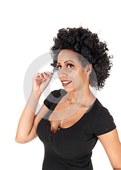 Happy young woman with a fussy black hair wig